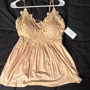 New camisole, tank top . Size L
Super cute